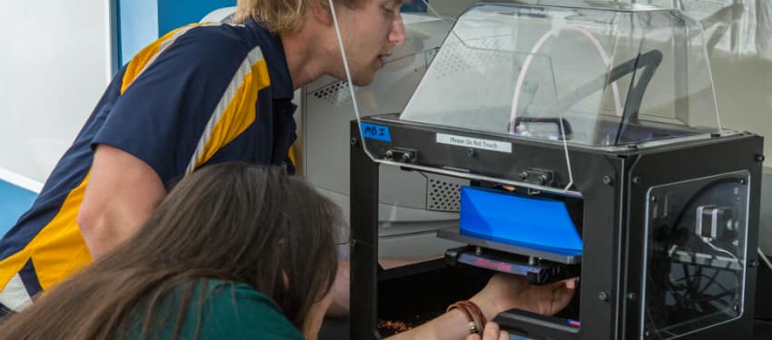 students work on a 3-D Printer