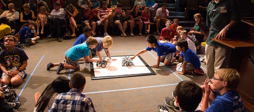 students playing with robots