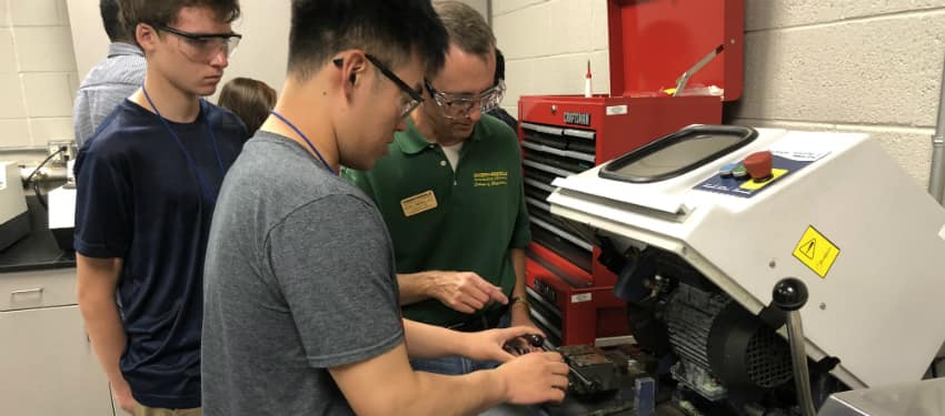 students working with engineering equipment