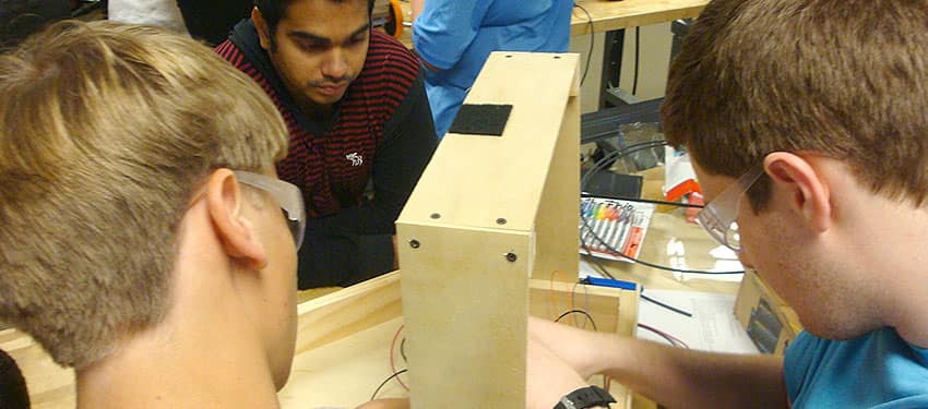 students building robotics equipment