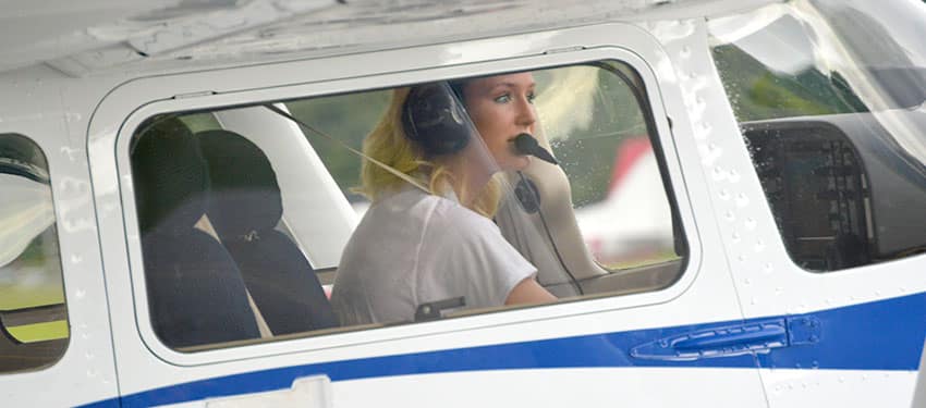 a female student in an airplane